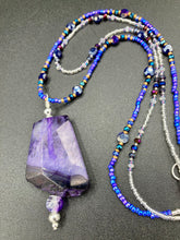 Load image into Gallery viewer, For The Love Of Nature - Vibrant Purple Agate Nature Stone With Two Strands of Multi-Color Glass Beaded Necklace. Large agate stone is full of purple hues from sheer, to vibrant violet, to deep dark purples. This beautiful agate necklace is the perfect summer necklace.   Measurements: Necklace is 15 1/2” adjustable up to 18" in length - pendant is 2 1/2” Height
