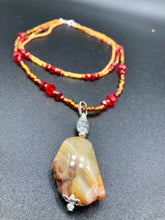 Load image into Gallery viewer, The Vibrant Yellow Agate Natural Stone Red Gold Beaded Choker Style Necklace is a fierce and bold statement piece. Featuring three strands of multi-color glass beads and a mixture of red and gold beads, this jewelry is a perfect addition to any collection. For a complete look, the merchant has created matching earrings. Necklace is 15” in length adjustable to 18" in length. Earrings are 1” length
