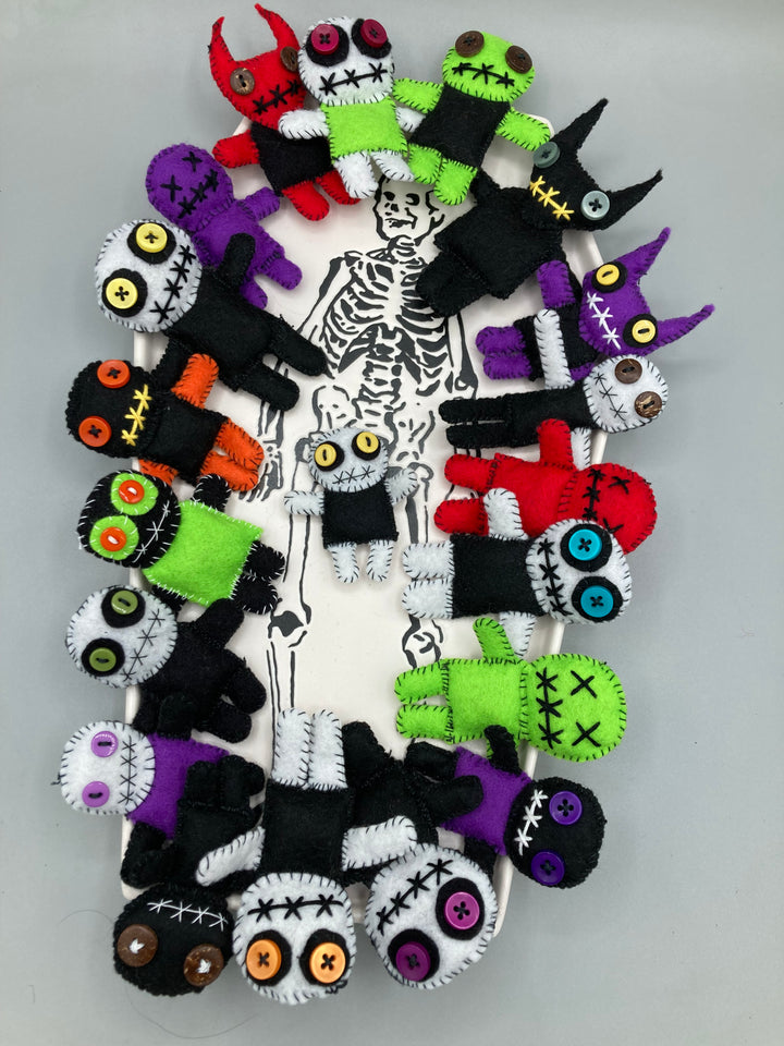 Hand made voodoo dolls in a wide range of colors