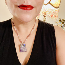 Load image into Gallery viewer, This beautiful trapezoid shaped amethyst wired pendant with hematite star bead is truly a beautiful and unique starry night necklace full of soft shimmer multi-color glass beads. Single beaded strand necklace has dusty rose glass beads that contain hues of pink, purple, blue and gold. Along the necklace I used larger but soft, dusty rose glass beads with iridescent beads. Necklace is 17” adjustable to 18&quot; in length -wired amethyst stone pendant is 1 3/4&quot; in height
