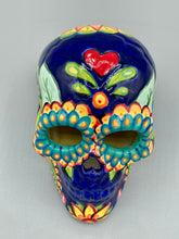 Load image into Gallery viewer, I wanted to create a skully that represented the eternal love for a special kitty cat in your life. Dark royal blue ceramic sugar skull with black cat silhouette is sitting admiring the sun going down. This Day Of The Dead ceramic skull art was created for the cat lovers who adore their sweet kitty. Measurements: H 4” x W 4” x D 5 1/2”
