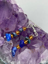 Load image into Gallery viewer, This single-stranded earring features natural lapis stone chips paired with light orange glass beads. Measurements: 1 3/16” in length  
