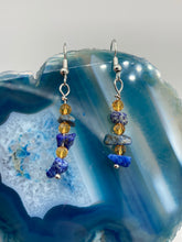 Load image into Gallery viewer, This single-stranded earring features natural lapis stone chips paired with light orange glass beads. Measurements: 1 3/16” in length  
