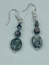 Load image into Gallery viewer, These tourmaline quartz and snowflake obsidian beaded earrings have a cool, neutral tone that's perfect for hippie and boho chic looks. The silver glass beads add a sparkle to any outfit and are ideal for anyone seeking a unique, nature-inspired style.  Measurements: 1 1/2” in length
