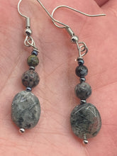 Load image into Gallery viewer, These tourmaline quartz and snowflake obsidian beaded earrings have a cool, neutral tone that's perfect for hippie and boho chic looks. The silver glass beads add a sparkle to any outfit and are ideal for anyone seeking a unique, nature-inspired style.  Measurements: 1 1/2” in length
