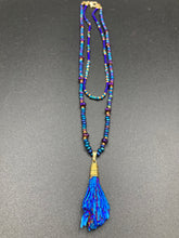 Load image into Gallery viewer, This structured royal blue kyanite stone pendant is 1 3/4” in length. The two accompanying strands of glass beads and rectangular hematite beads work together to bring out the vibrant colors of this celestial gemstone. In this combination, purples, blues, greens, and golds are juxtaposed for an eye-catching display.  Necklace is 15” in length, can be adjusted to 18&quot; in length 
