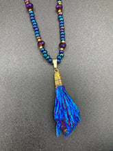 Load image into Gallery viewer, This structured royal blue kyanite stone pendant is 1 3/4” in length. The two accompanying strands of glass beads and rectangular hematite beads work together to bring out the vibrant colors of this celestial gemstone. In this combination, purples, blues, greens, and golds are juxtaposed for an eye-catching display.  Necklace is 15” in length, can be adjusted to 18&quot; in length 
