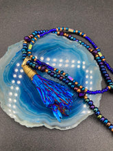 Load image into Gallery viewer, This structured royal blue kyanite stone pendant is 1 3/4” in length. The two accompanying strands of glass beads and rectangular hematite beads work together to bring out the vibrant colors of this celestial gemstone. In this combination, purples, blues, greens, and golds are juxtaposed for an eye-catching display.  Necklace is 15” in length, can be adjusted to 18&quot; in length 
