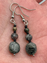 Load image into Gallery viewer, These earrings are crafted with tourmaline quartz, snowflake obsidian and black glass beads, creating a neutral cool look that is both unique and adaptable to any style.  Measurements: 1 1/2” in length
