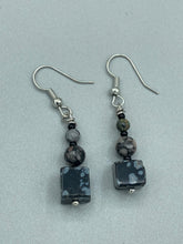 Load image into Gallery viewer, These Square Shape Snowflake Obsidian Beaded Earrings are perfect for achieving a boho chic and nature-inspired look. Featuring a cool tone stone set of beads, these earrings are large and perfectly versatile for a range of styles. Measurements: 1 1/4” in length
