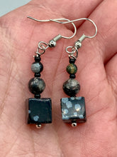 Load image into Gallery viewer, These Square Shape Snowflake Obsidian Beaded Earrings are perfect for achieving a boho chic and nature-inspired look. Featuring a cool tone stone set of beads, these earrings are large and perfectly versatile for a range of styles. Measurements: 1 1/4” in length
