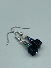 Load image into Gallery viewer, These eye-catching earrings feature a unique combination of large square-shaped black obsidian beads and two small square hematite beads, drawing inspiration from nature to give you a bohemian, hippie vibe. Perfect for a shabby chic, boho chic look. Measurements: 1” in length
