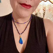 Load image into Gallery viewer, This structured royal blue kyanite stone pendant is 1 3/4” in length. The two accompanying strands of glass beads and rectangular hematite beads work together to bring out the vibrant colors of this celestial gemstone. In this combination, purples, blues, greens, and golds are juxtaposed for an eye-catching display.  Necklace is 15” in length, can be adjusted to 18&quot; in length 
