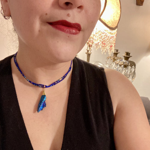 This bold Deep Royal Blue Kyanite Stone Wired Choker Style necklace features two strands of multi-colored glass beads. Perfect for nature-inspired, witch-celestial, Boho Shabby Chic and self-love styles, this accessory is the perfect addition to your wardrobe. Dress it up or down; this dynamic piece of jewelry is a must-have.  Measurements:    Necklace is 15” in length, adjustable to 18