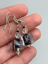 Load image into Gallery viewer, This striking set of earrings features large square-shaped clear glass beads adorned with black-and-white designs. Neutral-hued stone beads lend a cool feel, making them both unique and versatile. Measurements: 1 1/4” in length
