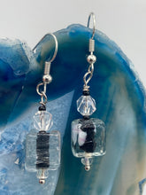 Load image into Gallery viewer, This striking set of earrings features large square-shaped clear glass beads adorned with black-and-white designs. Neutral-hued stone beads lend a cool feel, making them both unique and versatile. Measurements: 1 1/4” in length
