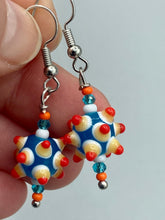 Load image into Gallery viewer, Vibrant color bumpy round lampworked glass bead set of earrings. Colorful teal, white, yellow, and bright orange festive piñata shaped bead.  This also reminds me of the shape of a virus. Either way, this is a super fun, unique, bold piece of jewelry, it&#39;s sure to make a statement piece.  Measurements: 1 1/4” in length
