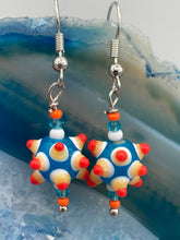 Load image into Gallery viewer, Vibrant color bumpy round lampworked glass bead set of earrings. Colorful teal, white, yellow, and bright orange festive piñata shaped bead.  This also reminds me of the shape of a virus. Either way, this is a super fun, unique, bold piece of jewelry, it&#39;s sure to make a statement piece.  Measurements: 1 1/4” in length
