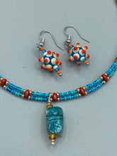 Load image into Gallery viewer, Vibrant color bumpy round lampworked glass bead set of earrings. Colorful teal, white, yellow, and bright orange festive piñata shaped bead.  This also reminds me of the shape of a virus. Either way, this is a super fun, unique, bold piece of jewelry, it&#39;s sure to make a statement piece.  Measurements: 1 1/4” in length
