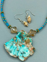 Load image into Gallery viewer, These dainty and delicate conch shell earrings provide a subtle and sophisticated addition to any ensemble. Nature lovers and beach-goers alike will appreciate the subtle ocean vibes these earrings bring, making them a perfect accessory for summer fashion.  Measurements: 3/4” in length 

