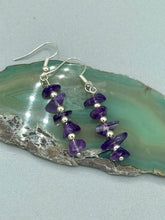 Load image into Gallery viewer, This single strand of beads is composed of natural amethyst stone chips and silver glass beads for a unique, bohemian look. Measurements: 1 1/2 ” in length 
