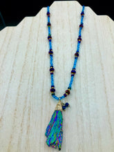 Load image into Gallery viewer, Rainbow Kyanite Wired Stone With Multi-Color Glass Beads Necklace. I used a combination of deep purples, turquoise blues, and golds to really capture the essence of this celestial galaxy stone. This beautiful necklace and rainbow kyanite pendant is a must have jewelry piece to add to your collection.  Measurements: Necklace is 16” adjustable up to 18&quot; in length - pendant is 2” Height
