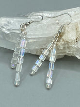 Load image into Gallery viewer, These elegant earrings are crafted with two delicate strands of iridescent rectangular and round glass beads.  Measurements: 1 3/4” in length  
