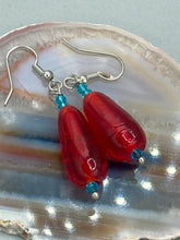 Load image into Gallery viewer, This eye-catching piece set of earrings consists of large fire engine red and tiny teal glass beads for a vibrant and bold look.  Measurements: 1 1/2” in length 
