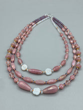 Load image into Gallery viewer, This three-strand beaded necklace is crafted with iridescent dusty rose glass, along with white, gold, pink, and iridescent purple beads for an eclectic mix of colors, tones, and textures. Perfect for any occasion, this gorgeous statement piece will add the finishing touch to your look.   Measurements:   Necklace is 17” in length, can be adjusted up to 19&quot; 
