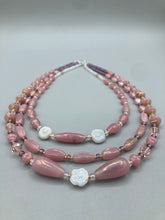 Load image into Gallery viewer, This three-strand beaded necklace is crafted with iridescent dusty rose glass, along with white, gold, pink, and iridescent purple beads for an eclectic mix of colors, tones, and textures. Perfect for any occasion, this gorgeous statement piece will add the finishing touch to your look.   Measurements:   Necklace is 17” in length, can be adjusted up to 19&quot; 
