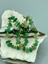 Load image into Gallery viewer, Elegant hoop earrings featuring natural green aventurine stone chips and gold-tinged glass beads. Measurements: 2&quot; length and 1 1/2” in width  
