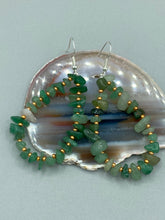 Load image into Gallery viewer, Elegant hoop earrings featuring natural green aventurine stone chips and gold-tinged glass beads.  Measurements: 2&quot; length and 1 1/2” in width  
