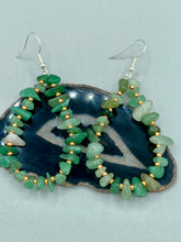 Load image into Gallery viewer, Elegant hoop earrings featuring natural green aventurine stone chips and gold-tinged glass beads. Measurements: 2&quot; length and 1 1/2” in width  
