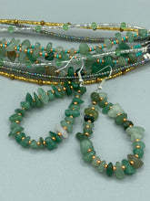 Load image into Gallery viewer, Elegant hoop earrings featuring natural green aventurine stone chips and gold-tinged glass beads.  Measurements: 2&quot; length and 1 1/2” in width  
