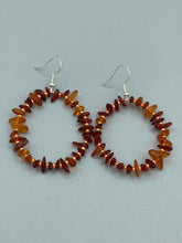Load image into Gallery viewer, These hoop earrings feature natural amber stone chips and gold glass beads for an elegant, nature-inspired look.  Measurements: 2&quot; length and 2” in width   
