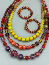 Load image into Gallery viewer, These hoop earrings feature natural amber stone chips and gold glass beads for an elegant, nature-inspired look.  Measurements: 2&quot; length and 2” in width   
