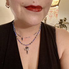 Load image into Gallery viewer, Soft Blue and Silver Adjustable Choker Style Glass Beaded Necklace With A Silver Dragonfly Pendant. Whimsical smiling crescent moon dangling charm comes matching earrings. Dainty elegant summer necklace has the perfect witchy, whimsical, magical, starry night look, it will complete any look.  Measurements: Necklace is 15” adjustable up to 18&quot; in length - pendant is nickel free and 1 1/2” Height
