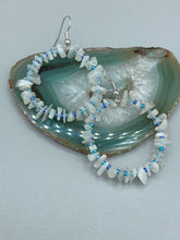 Load image into Gallery viewer, These nature-inspired White Moon Stone Chip Beaded Hoop Earrings are the perfect accessory for adding a boho-chic vibe to any look. Crafted with natural white moon stone chips and blue glass beads, these earrings will complete your outfit with the ultimate hippie and shabby-chic feel. Measurements: 1 1/2" length
