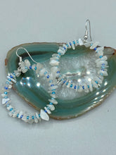 Load image into Gallery viewer, These nature-inspired White Moon Stone Chip Beaded Hoop Earrings are the perfect accessory for adding a boho-chic vibe to any look. Crafted with natural white moon stone chips and blue glass beads, these earrings will complete your outfit with the ultimate hippie and shabby-chic feel. Measurements: 1 1/2" length
