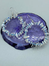 Load image into Gallery viewer, These nature-inspired White Moon Stone Chip Beaded Hoop Earrings are the perfect accessory for adding a boho-chic vibe to any look. Crafted with natural white moon stone chips and blue glass beads, these earrings will complete your outfit with the ultimate hippie and shabby-chic feel. Measurements: 1 1/2" length
