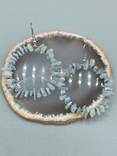 Load image into Gallery viewer, These nature-inspired White Moon Stone Chip Beaded Hoop Earrings are the perfect accessory for adding a boho-chic vibe to any look. Crafted with natural white moon stone chips and blue glass beads, these earrings will complete your outfit with the ultimate hippie and shabby-chic feel. Measurements: 1 1/2" length
