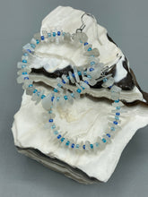 Load image into Gallery viewer, These nature-inspired White Moon Stone Chip Beaded Hoop Earrings are the perfect accessory for adding a boho-chic vibe to any look. Crafted with natural white moon stone chips and blue glass beads, these earrings will complete your outfit with the ultimate hippie and shabby-chic feel. Measurements: 1 1/2" length
