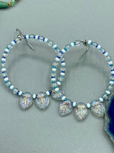 Load image into Gallery viewer, These Pressed Glass Leaf Beaded Hoop Earrings are perfect for a shabby chic, bohemian, or hippie vibe. The iridescent glass beads give off a soft and glamorous sparkle, while the clear glass charms have a shimmer finish with hints of gold, purple, blue and pink. They are the perfect nature-inspired accessory. Measurements: 2&quot; length
