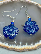 Load image into Gallery viewer, This Dark Blue Violet Floral Pressed Glass Beaded Earrings feature a captivating iridescent shimmer finish that adds beautiful detail. Measurements: 1 1/4&quot; length
