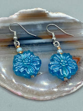Load image into Gallery viewer, This light blue pressed glass floral bracelet is a sophisticated addition to any summer look. Its iridescent shimmer finish adds a classy touch to its intricate metal wire and lobster claw clasp. Perfect for any nature-inspired wardrobe. Measurements:  Bracelet: 8&quot; in length   Earrings: 1 1/4&quot; length
