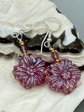 Load image into Gallery viewer, Add a touch of bohemian style to your look with these unique light purple pink flower glass earrings. Featuring detailed pressed glass beads and an iridescent shimmer finish, these earrings are perfect for a hippie vibe, shabby chic, or boho chic look. Nature-inspired and chic, these are the perfect earrings for any occasion. Measurements: 1 1/4&quot; length
