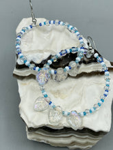 Load image into Gallery viewer, These Pressed Glass Leaf Beaded Hoop Earrings are perfect for a shabby chic, bohemian, or hippie vibe. The iridescent glass beads give off a soft and glamorous sparkle, while the clear glass charms have a shimmer finish with hints of gold, purple, blue and pink. They are the perfect nature-inspired accessory. Measurements: 2&quot; length
