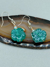 Load image into Gallery viewer, Upgrade your style with these sophisticated blue-green floral pressed glass earrings. Their iridescent glimmer finish adds a glamorous touch for any occasion. Crafted from lightweight glass, each design is both eye-catching and comfortable to wear. Measurements: 1 1/4&quot; length
