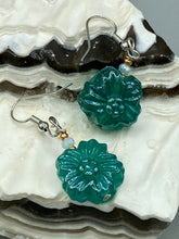 Load image into Gallery viewer, Upgrade your style with these sophisticated blue-green floral pressed glass earrings. Their iridescent glimmer finish adds a glamorous touch for any occasion. Crafted from lightweight glass, each design is both eye-catching and comfortable to wear. Measurements: 1 1/4&quot; length
