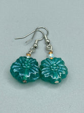 Load image into Gallery viewer, Upgrade your style with these sophisticated blue-green floral pressed glass earrings. Their iridescent glimmer finish adds a glamorous touch for any occasion. Crafted from lightweight glass, each design is both eye-catching and comfortable to wear. Measurements: 1 1/4&quot; length
